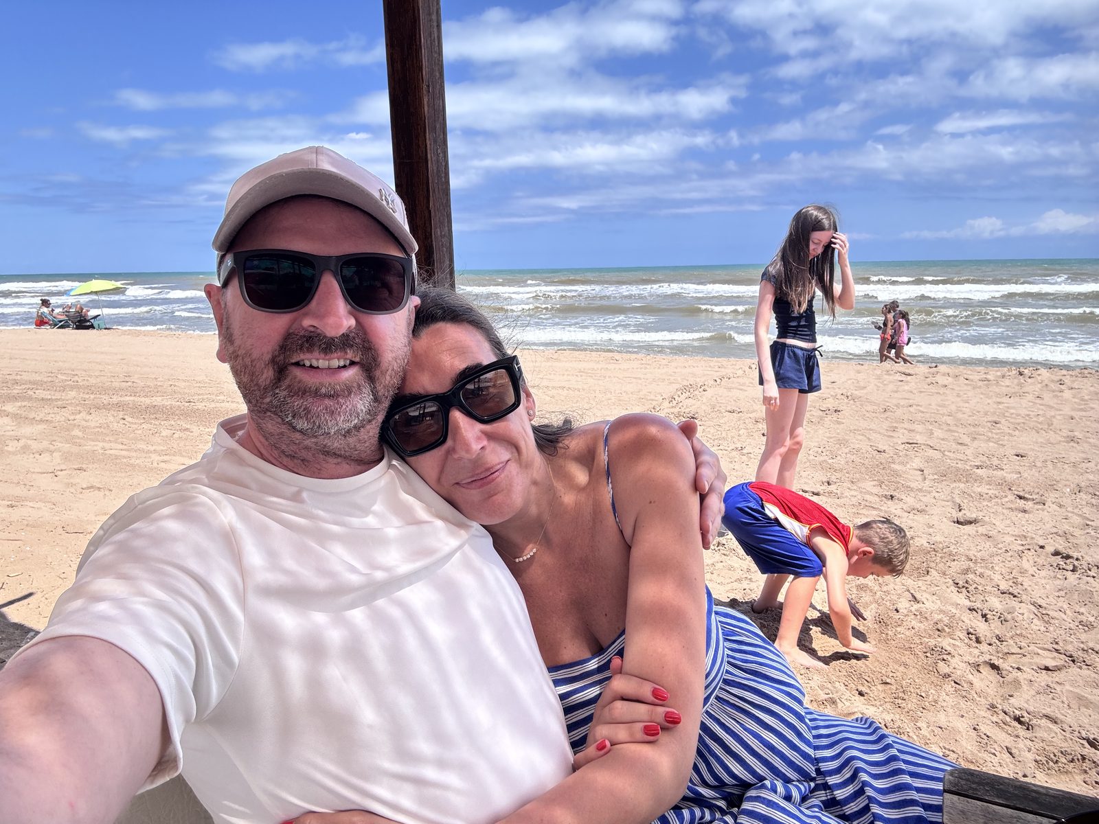 Cristina and Joe on the beach with family