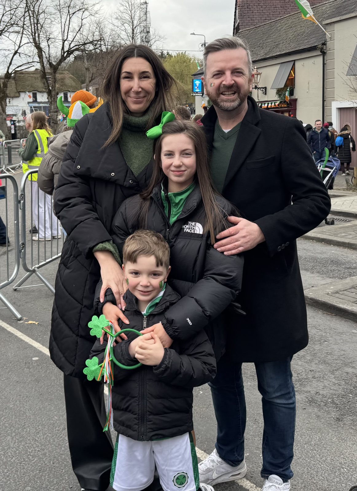 Cristina and Joe with the kids at a St. Patrick's Day parade